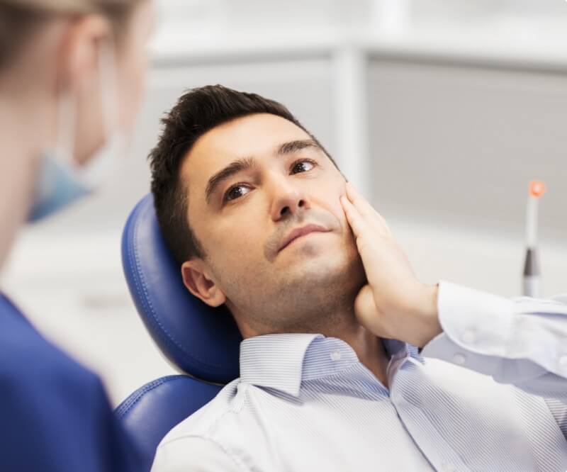 Man receiving emergency dentistry treatment