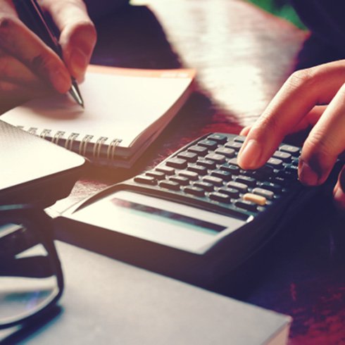 Woman using a calculator