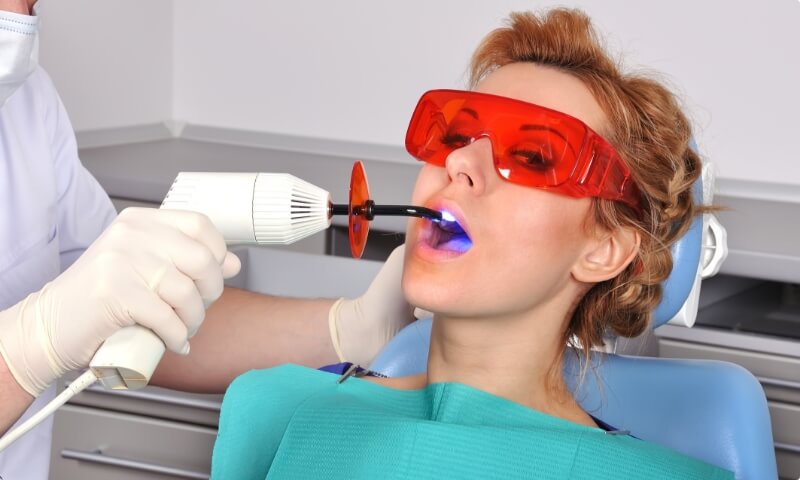Woman receiving dental fillings