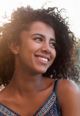 Woman with healthy smile after preventive dentistry