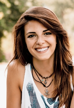 Young woman with perfectly aligned smile after Clear Correct