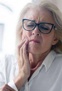 Woman in pain before emergency dentistry