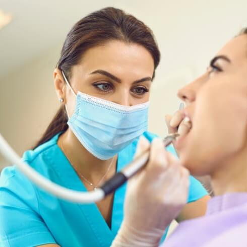 Dental patient receiving scaling and root planing treatment