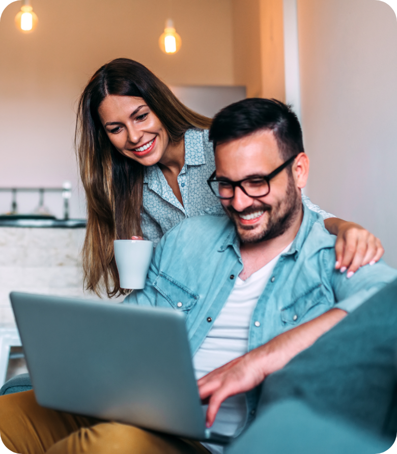 Man and woman using a laptop to book an appointment online