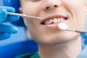 Patient with broken front tooth being tended to.