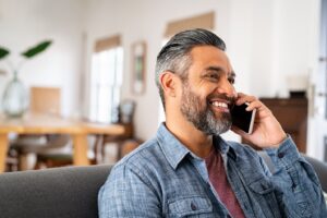 middle-aged man talking on his cell phone